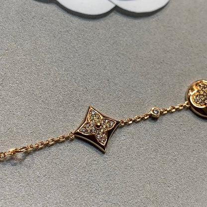 [BLAUE TRÄNEN] GOLDARMBAND MIT 4 MOTIVEN, STERN UND SONNE UND DIAMANTEN