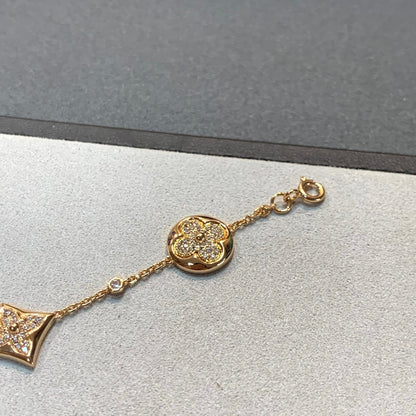 [BLAUE TRÄNEN] GOLDARMBAND MIT 4 MOTIVEN, STERN UND SONNE UND DIAMANTEN