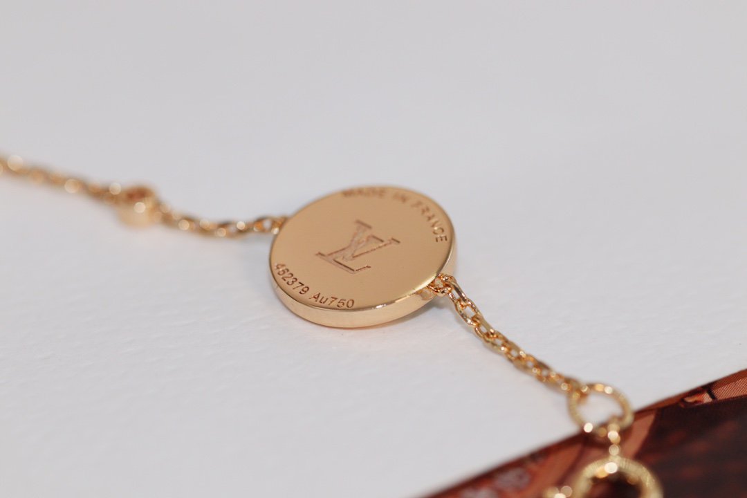 [BLAUE TRÄNEN]ARMBAND AUS ROTGOLD MIT MALACHIT UND STERNEN UND SONNE