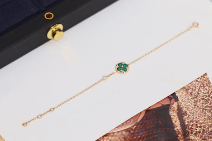 [BLAUE TRÄNEN]ARMBAND AUS ROTGOLD MIT MALACHIT UND STERNEN UND SONNE